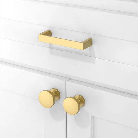 Close-up of white cabinets with 10 Pack Brushed Gold Cabinet Pulls 3 Inch 76mm Solid Zinc Alloy Drawer Handles For Kitchen Cabinets