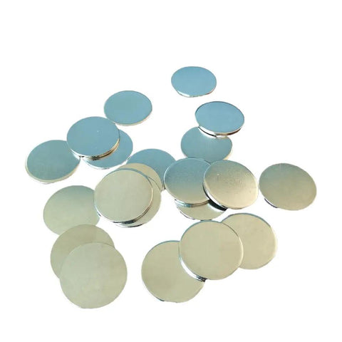 Slick Nickel Coated Steel Discs.98 Inch Diameter With Smooth Chamfered Edges Rock Solid Blanks ready to roll in a scattered layout.
