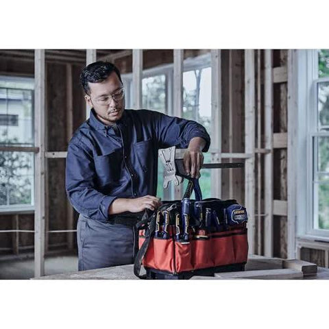 IRWIN Quick-Lift construction jack in a red tool bag with branding; worker in a workshop.