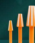Three orange cleaning cones from Spindle Cleaning Equipment Kit For CNC Machining Centers BT30 BT40 BT50 on green background.