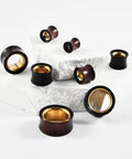Two Tone Hollow Gold Stainless Steel And Sandalwood Ear Tunnels Plugs Set For Stretched Ears 0G To 1 Inch Displayed On White