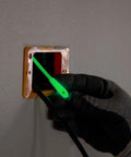 Glow In The Dark 20 Foot Fiberglass Fish Tape With Nylon Tip And Stainless Steel Connector Removable Case For Versatile Wire Feeding And Quick Pass Through Made In USA tool being fed through an electrical outlet.