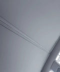 Interior view of Tesla Model Y Roof Sunshade Full Blackout with Graphene Enhanced UV Coating installed, showing seamless fit and gray fabric.
