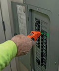 Hand using Circuit Breaker Finder Tool Kit With Accessories And GFCI Outlet Tester, 2 Piece Set Including ET310 And 69411 on panel