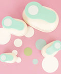 Assorted turquoise 3-inch circle punches with cut paper circles, ideal for scrapbooking and card making. Three Inch Circle Hole Punch With Lever.