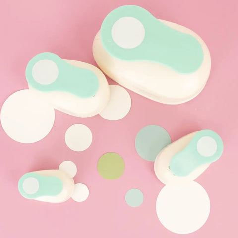 Assorted turquoise 3-inch circle punches with cut paper circles, ideal for scrapbooking and card making. Three Inch Circle Hole Punch With Lever.