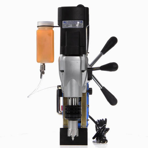 Front view of AC50 portable magnetic drill press with orange coolant bottle attached