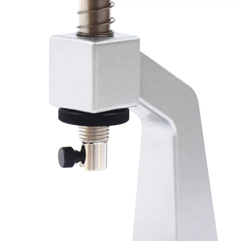 Close-up of the Adjustable Watch Case Back Opener Bench Tool for opening and closing screw down snap off covers, silver metal detail.