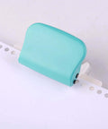 Portable handheld metal circle paper punch with green finish on paper; Handy 6 Hole Puncher For A4 A5 B5 Notebooks And Scrapbooks.