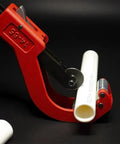 Heavy Duty Pipe Tubing Cutter For Plastic Pipes Five Ninths Inch To Two And Five Ninths Inch Outer Diameter Cuts PVC PPR PE Tubes With Quick Release Lever And Bearing Steel Wheel For Fast Clean Cuts, shown cutting a white plastic pipe