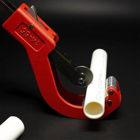 Heavy Duty Pipe Tubing Cutter For Plastic Pipes Five Ninths Inch To Two And Five Ninths Inch Outer Diameter Cuts PVC PPR PE Tubes With Quick Release Lever And Bearing Steel Wheel For Fast Clean Cuts, shown cutting a white plastic pipe