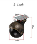 Heavy Antique Brass Casters With Swivel Brake And Slick Moving Wheels For Living Room Sofa And Ottoman Set Of Four Hardcore Big Time Base Makeover close-up view showing 2-inch size and black wheel.