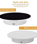 Qinmay 360 Degree Electric Rotating Turntable Display Stand Rechargeable Low Noise with white velvet top and black velvet detail.