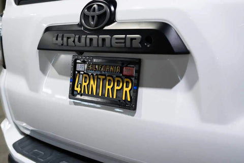 Subdued 3D Embossed American Flag License Plate Frame With Black Gloss On Matte Finish For Car Truck Or SUV Featuring Thin Blue Line