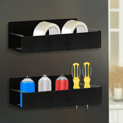 Black magnetic aerosol can holders with four hooks, holding spray cans, tape, and screwdrivers, mounted on a wall.