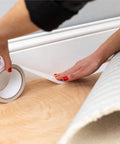 Applying Indoor Outdoor Carpet Tape One Point Four One Inch By Forty Two Feet White Fiberglass Reinforced Durable Adhesive for installation.