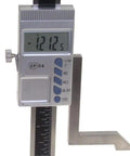 Close-up of digital height gauge with magnetic base showing 121.2 mm, for woodworking, 6 inch capacity, precision 0.0005 inch.