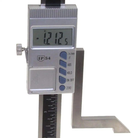 Close-up of digital height gauge with magnetic base showing 121.2 mm, for woodworking, 6 inch capacity, precision 0.0005 inch.