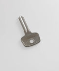 Universal Lock Core Removal Key For Thule And Yakima Roof Rack Systems D1251 D1252 8007835 8531251 metallic key on white background