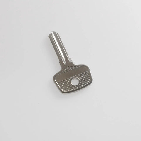 Universal Lock Core Removal Key For Thule And Yakima Roof Rack Systems D1251 D1252 8007835 8531251 metallic key on white background