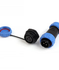 IP68 Waterproof Panel Mount Connector Set For Back Nut Plugs And Sockets With Male And Female Ends Built Tough For Heavy Duty Electrical Cable Wire Installations 2 3 4 5 7 9 12 Pin Configurations. Blue and black connectors with visible pin ends.