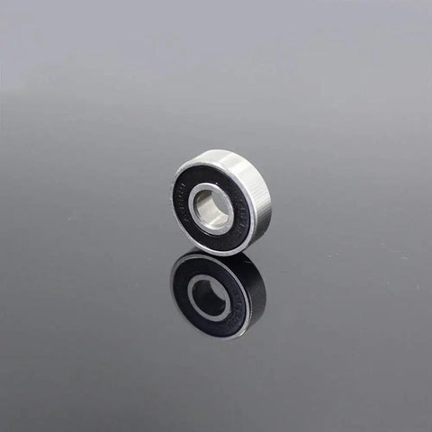 Pro Grade 608 2RS Hybrid Ceramic Bearings With Abec 7 Precision An 8 Pack Sized At 8X22X7MM For Skateboards And Roller Skates on reflective surface.