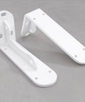 Super Tough White Iron Wall Mount Floating Shelf Brackets With Reinforced Triangle Brace To Haul Heavy Loads Without Breaking A Sweat Includes Complete Mounting Kit For Easy Setup That Actually Holds Up, showing two white brackets.