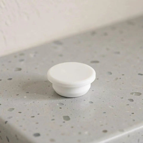 Silicone Bathtub Seal Plug for 30-31mm White 5pcs Round Openings on a grey countertop.