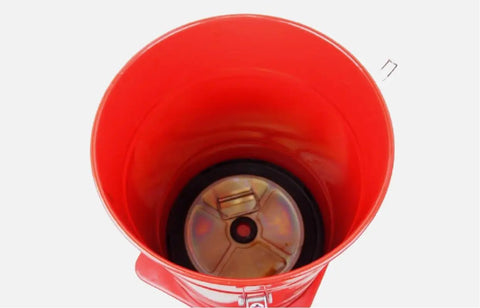 Built Like A Tank Air Pneumatic Grease Gun 8 Gallon High Pressure Lubricator For Commercial Trucks And Tractor Implements interior view of red tank with silver bottom.