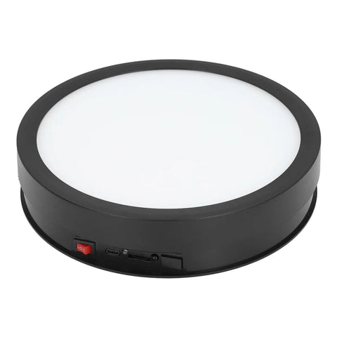 Huge 360 Degree Electric Rotating Turntable Stand With Remote Control And Adjustable Speed Plus Colorful LED Lighting For Pro Product Photography Videos And Live Streams Using USB Power, black base with white top.
