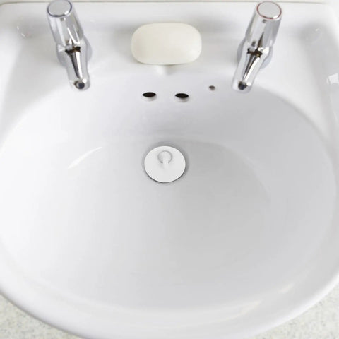 4pcs Rubber Bathtub Drain Stopper with Pull Ring in a white sink, featuring a tight sealing design for leakage prevention.