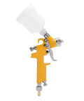Rock Solid And Compact 125Ml Mini Spray Gun With Easy Turn Triple Knobs For Hella Smooth Paint Jobs On Cars Furniture And Walls Featuring A Precise 1Mm Nozzle Tip side view with white cup and yellow handle.