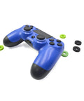 Blue game controller with Ten Pack Controller Aim Assist Rings For Thumbsticks With Sponge Motion Control Grips scattered around