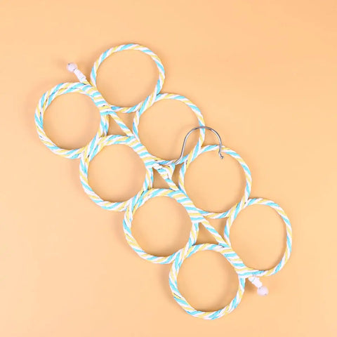 Double Sided Scarf Hanger Closet Organizer Foldable Paper Rattan 12 Ring Tie Holder with Rock Solid Steel Hook on orange background.