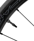 Close-up of a road bike wheel with a visible metal Presta valve for 2 Pack Ultra Light TPU Road Bike Tubes For 700x18-32C And 32-47C.