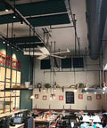 Heavy Duty Ten Foot Wide Area Cooling Fan With Brushless Motor And Built In VFD Drive For Factory Breeze, installed in a restaurant setting.