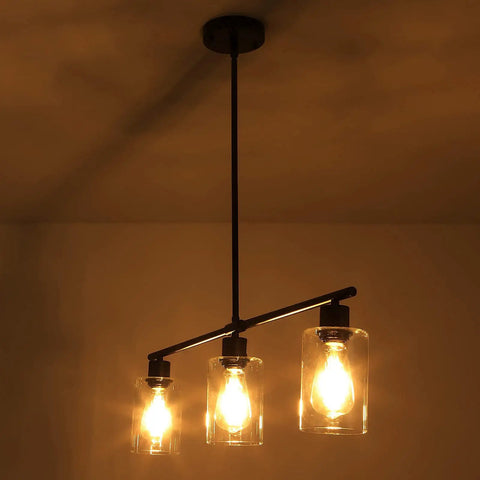 Three Light Modern Kitchen Island Pendant Light With Glass Shades Slick Black Metal Finish Rustic Farmhouse Chandelier in warm light