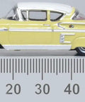 1958 Chevy Impala Sport Diecast Model Car 1/87 HO Scale Colonial Cream With Snowcrest White Top side view near ruler