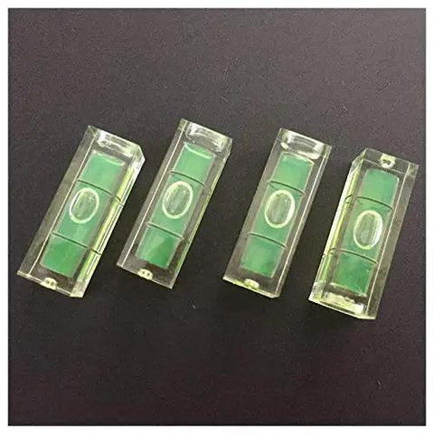 4Pcs 10x10x29mm Universal Square Bubble Spirit Level Tripod Measuring Camera in clear casings on a black background.