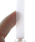 Heavy Duty Polypropylene Strapping Roll Six Thousand Feet Half Inch Wide Point Zero Three Thick Three Hundred Pound Break Strength Standard Core held by a finger.