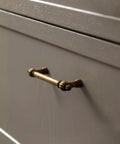Antique Brass Zinc Alloy Cabinet Pulls Three And Three Quarters Inch Hole Center installed on a kitchen cabinet drawer