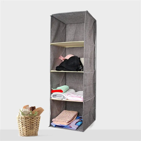 Kick Up Your Closet Game With This Slick Hanging Wardrobe Organizer Featuring A Spacious Mezzanine Drawer And Multi Pocket Portable Rack In Beige. Portable hanging organizer with fabric shelves displaying folded clothes.