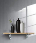 Heavy Duty White Wall Shelf Brackets Rock Solid Angle Mounts Hold Firm Up To 220 Lbs Stress Free Setup For Custom Boards And Leveling Out Cluttered Corners 2 Piece Set 130 by 335 Mm with decorative vases on a wooden shelf.