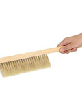 Hand holding Two Pack Beekeeping Bee Brushes With Long Sixteen Point One Inch Wooden Handles And Natural Horsehair Bristles Soft Hive