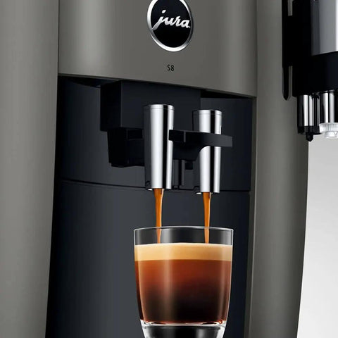 Premium Smart Automatic Coffee And Espresso Machine Featuring One Touch Brewing Sweet Foam Syrup Function that pours espresso into a glass.