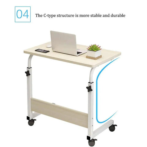 Grab And Go Adjustable Laptop Desk With Smooth Casters Dead Simple Height Tweaks For Living Room Hustle Setup Or Bedside Chill Spot In Modern Matte Black Finish, C-type structure with laptop and plant.