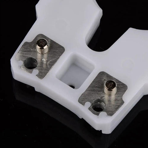 Close-up of Pro Grade Tool Holder Clamp for CNC machines with metal plates, showcasing wear and heat-resistant ABS, focus on clamp details.