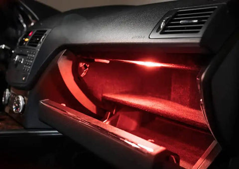 Kickin Red LED Glove Box And Footwell Lights For Volkswagen Vehicles installed in glove box, emitting red glow, interior view