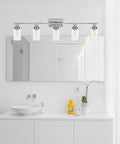 Industrial Chrome Five Light Vanity Light Fixture With Clear Glass Shades Modern Wall Sconces in a white bathroom setting