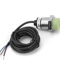 Inductive Proximity Sensor Switch With 15mm Detection Range NPN Normally Open Output Plated Brass Body, shown with connection wires.